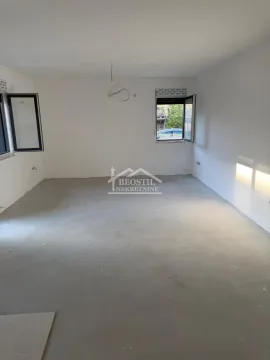 Empty unfinished room with white walls and windows. - image 15
