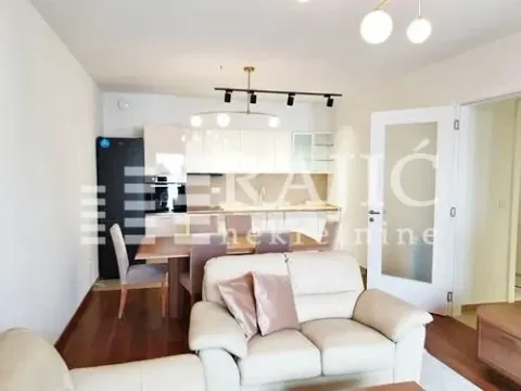 Spacious living room connected to the dining area and kitchen. - image 8