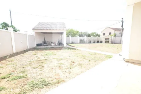Spacious yard with an outbuilding and barbecue area. - image 29