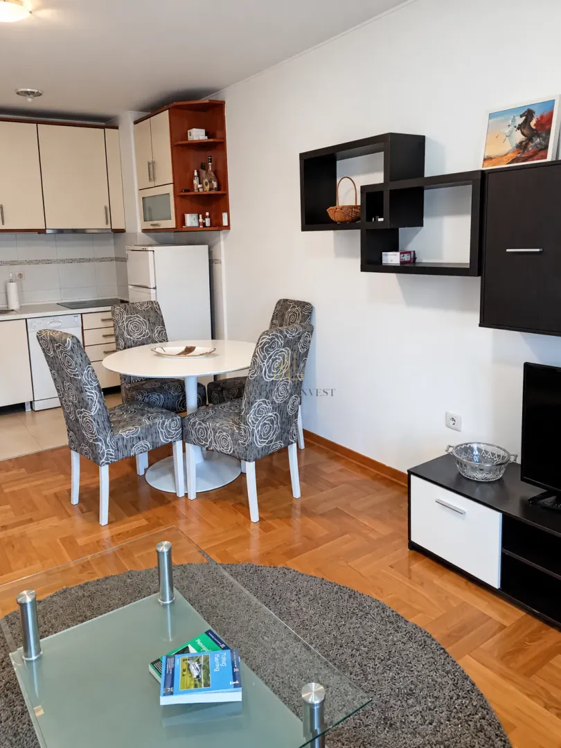 Living room with dining area and part of the kitchen.