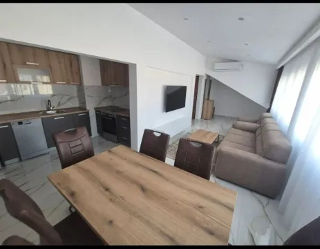 Living room with dining area and open-plan kitchen. - image 6
