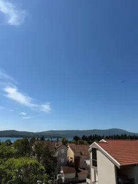View of the sea and surrounding houses from the property terrace. - image 8