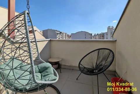 Furnished terrace with a hanging chair, armchair, and city view. - image 5