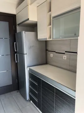 Modern kitchen cabinets with a refrigerator. - image 12