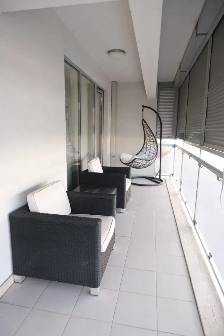Spacious and bright terrace equipped with comfortable outdoor furniture.
