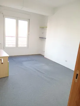 Empty room with a window and a grey carpet. - image 15