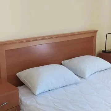Furnished bedroom with a double bed. - image 7