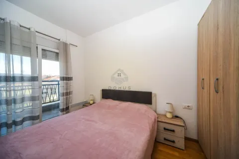 Furnished bedroom with a double bed, wardrobe, and access to the terrace. - image 4
