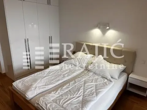 Furnished bedroom with a double bed and a fitted wardrobe. - image 6