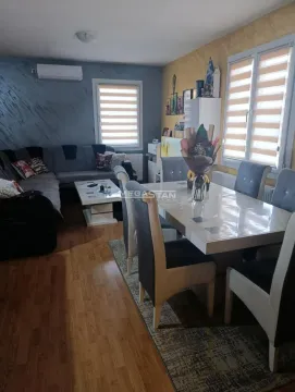 Living room with a dining area, sofa set, and dining table. - image 10