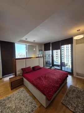 Spacious bedroom with a large double bed and access to the terrace. - image 14