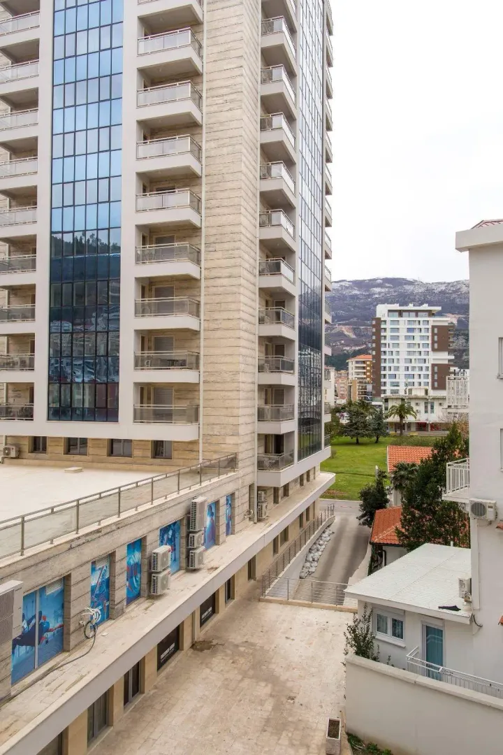 View of the exterior of a modern residential building and surroundings.