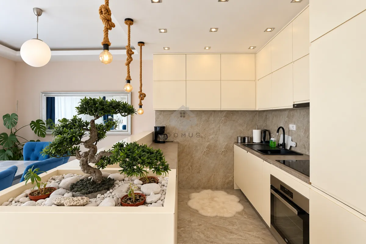 Modern kitchen with built-in cabinetry and a decorative indoor garden.