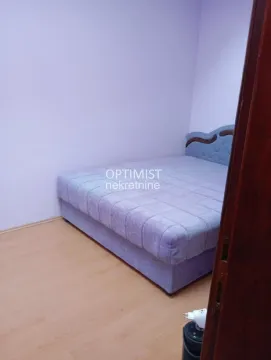 Bedroom with a double bed and laminate flooring. - image 8