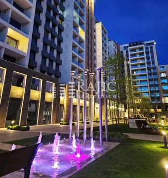 Evening view of the courtyard and residential building facade with a fountain. - image 9