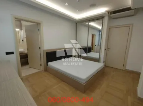 Furnished bedroom with a double bed, mirrored wardrobe, and an en-suite bathroom. - image 10