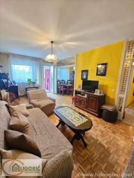 Living room with a sofa, coffee table and TV unit. - image 4