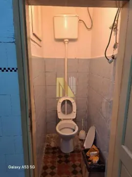 Small bathroom with a toilet and wall-mounted cistern. - image 7