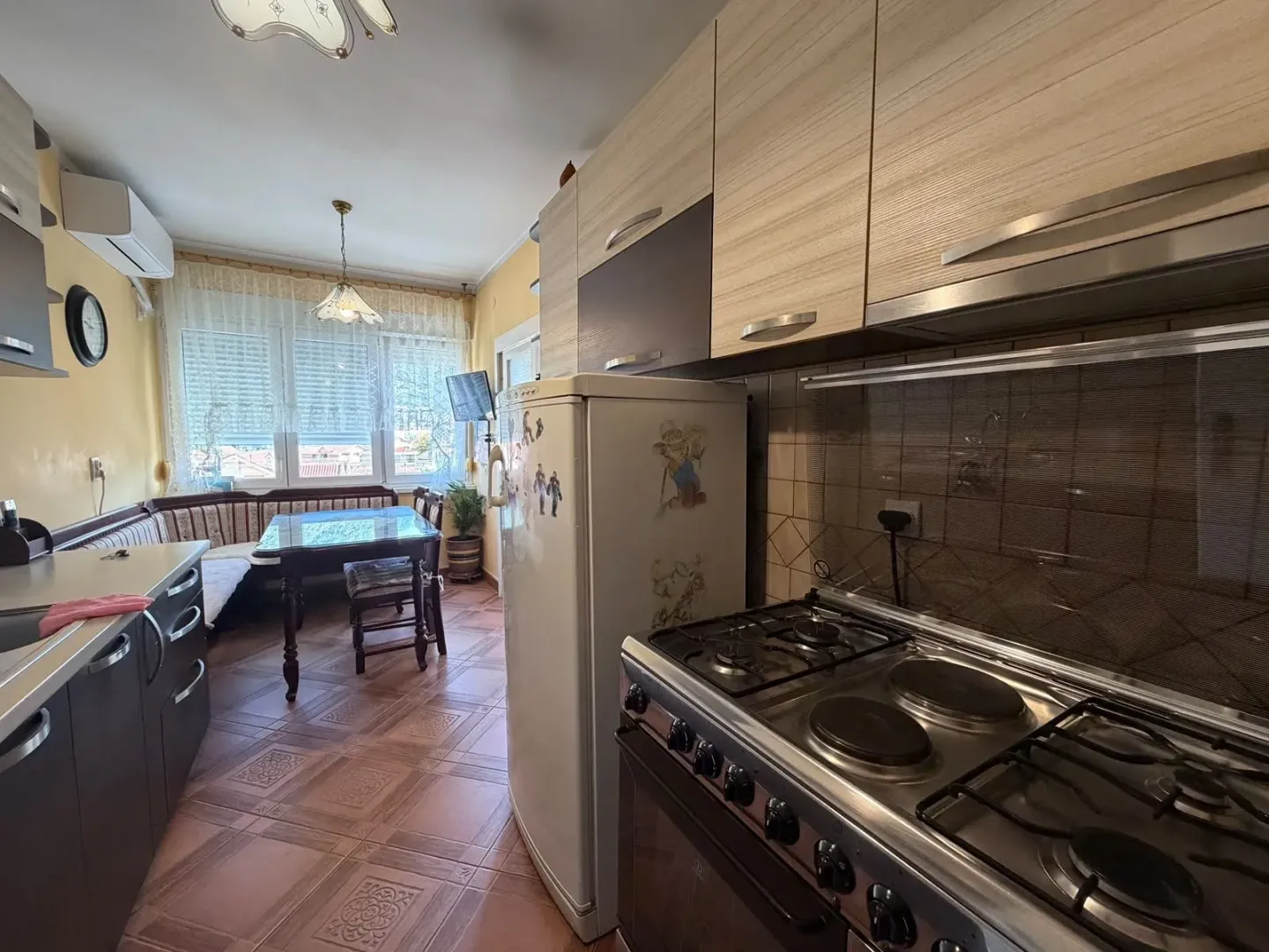 Spacious kitchen with a dining area and fitted cabinets.