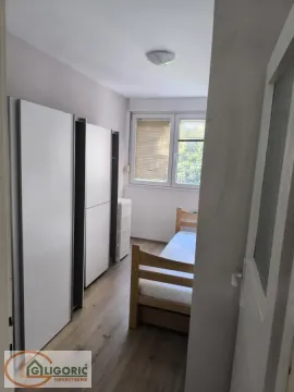 Small bedroom with a bed and fitted wardrobes. - image 8
