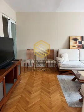 Living room with sofa, TV and parquet flooring. - image 9