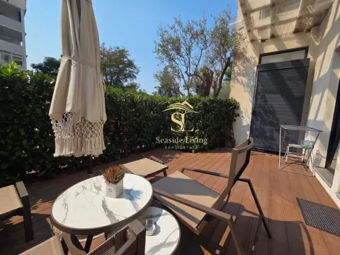 Furnished terrace with seating furniture and green views. - image 13