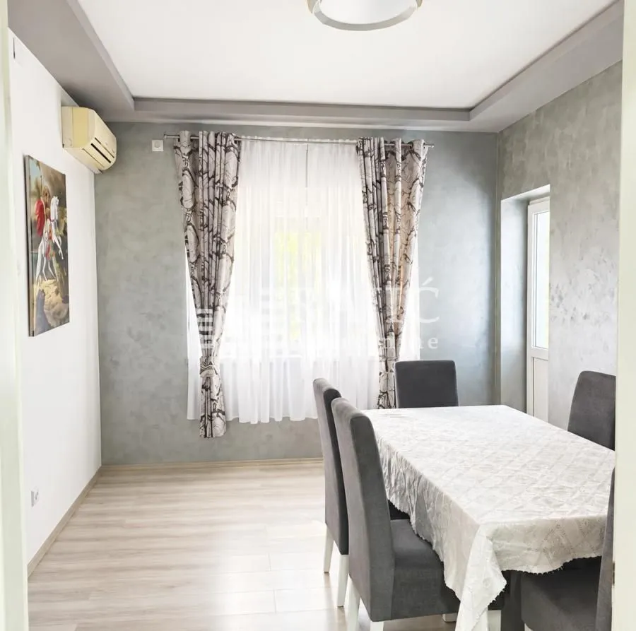Living room with a dining table and chairs.