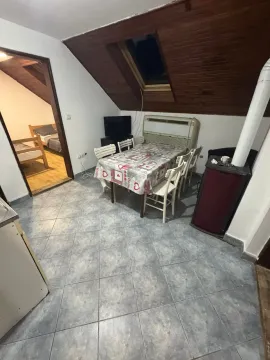 Living room with a dining area and wood-burning stove in the attic. - image 8