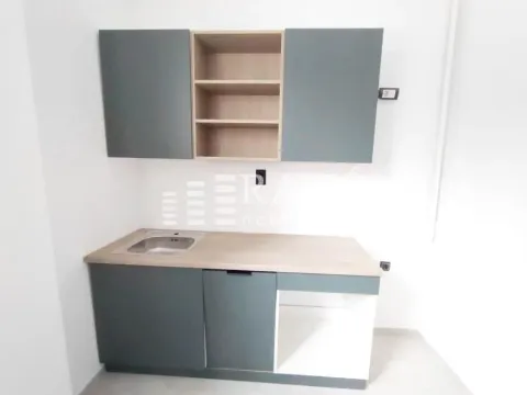 Smaller kitchen with cabinetry and a sink. - image 6