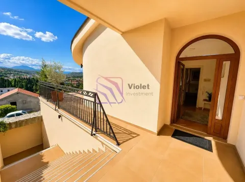View of the house entrance with stairs and a terrace. - image 2