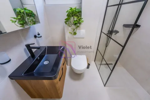Modern bathroom with a washbasin, toilet bowl and shower cabin. - image 20