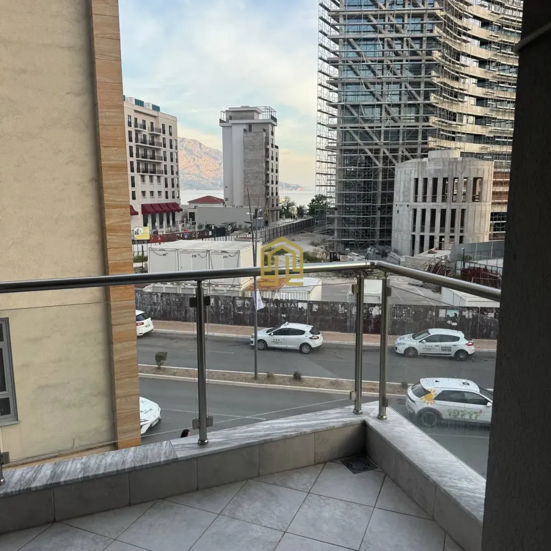 View from the balcony overlooking the street and surrounding buildings under construction.
