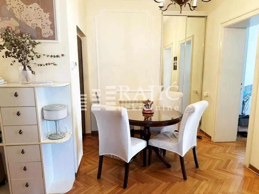 Dining area with a table, chairs, and built-in closet.