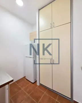 Small kitchen with a refrigerator and built-in closet. - image 7