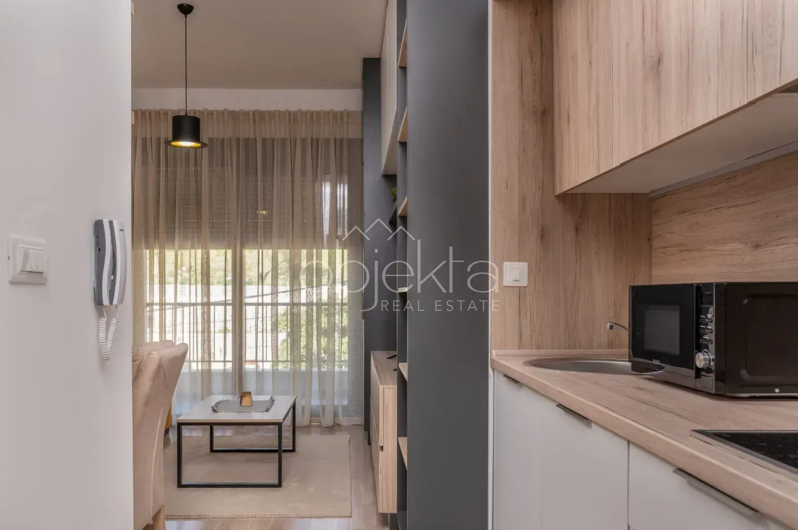 View from the kitchen towards the dining and living area with access to the terrace.