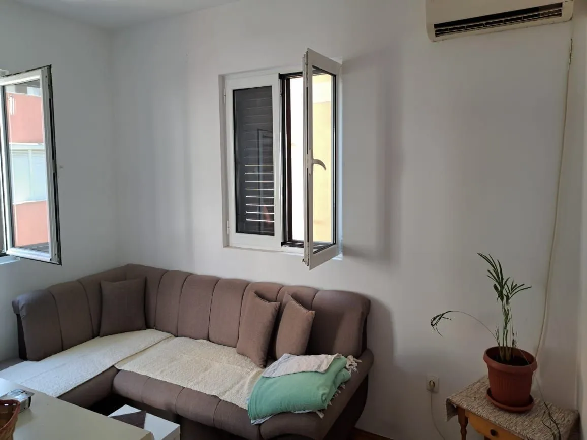 Living room with a corner sofa and a window.