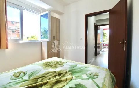 Furnished bedroom with a bed and wardrobe. - image 6