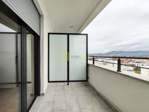 Covered balcony with tiled flooring and a view of the neighborhood and surrounding hills. - image 4
