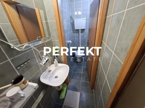 Smaller bathroom with a sink and a toilet. - image 2