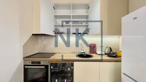 Small equipped kitchen with open wall cabinets and built-in appliances. - image 6
