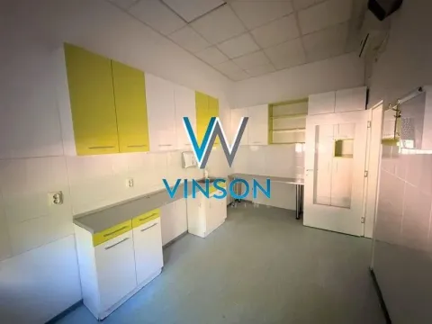 Kitchen equipped with white and yellow cabinetry, countertops, and a sink. - image 6