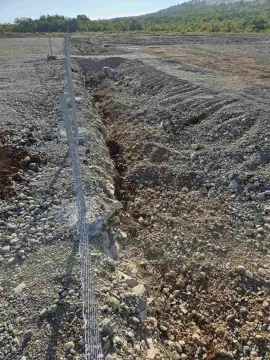 Prepared ground and an excavated trench on a fenced construction plot. - image 8