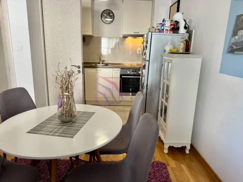 Kitchen with a dining table and chairs. - image 3