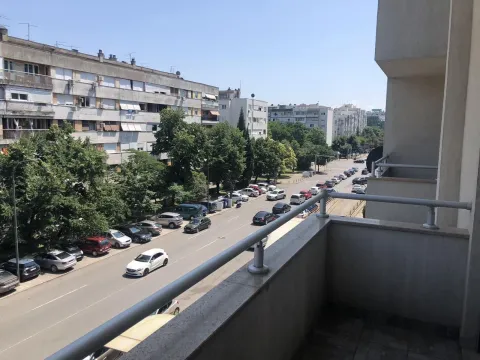 View from the balcony overlooking the street and surrounding buildings. - image 18