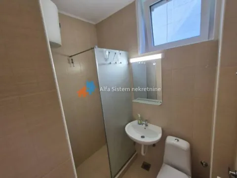 Bathroom with a shower cabin, washbasin, and toilet. - image 14