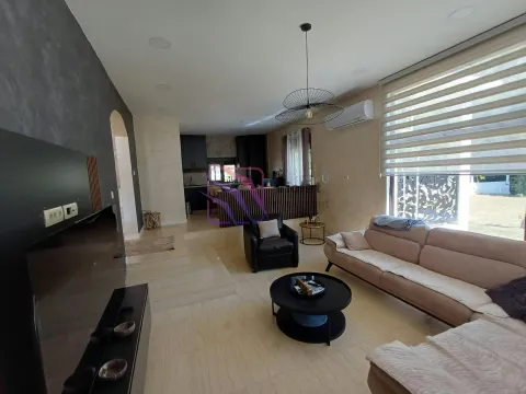 Spacious living room connected to the kitchen and dining area. - image 11