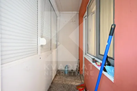 Enclosed balcony with blinds and a window looking inside. - image 2