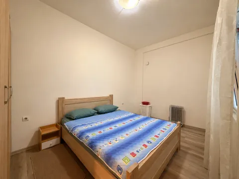 Furnished bedroom with a double bed and wardrobe. - image 8