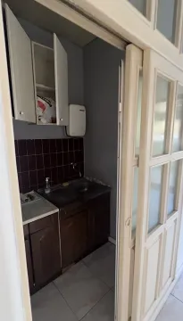 Small kitchen viewed through a sliding door. - image 6