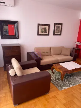 Living room with sofa set, coffee table, and chest of drawers. - image 4
